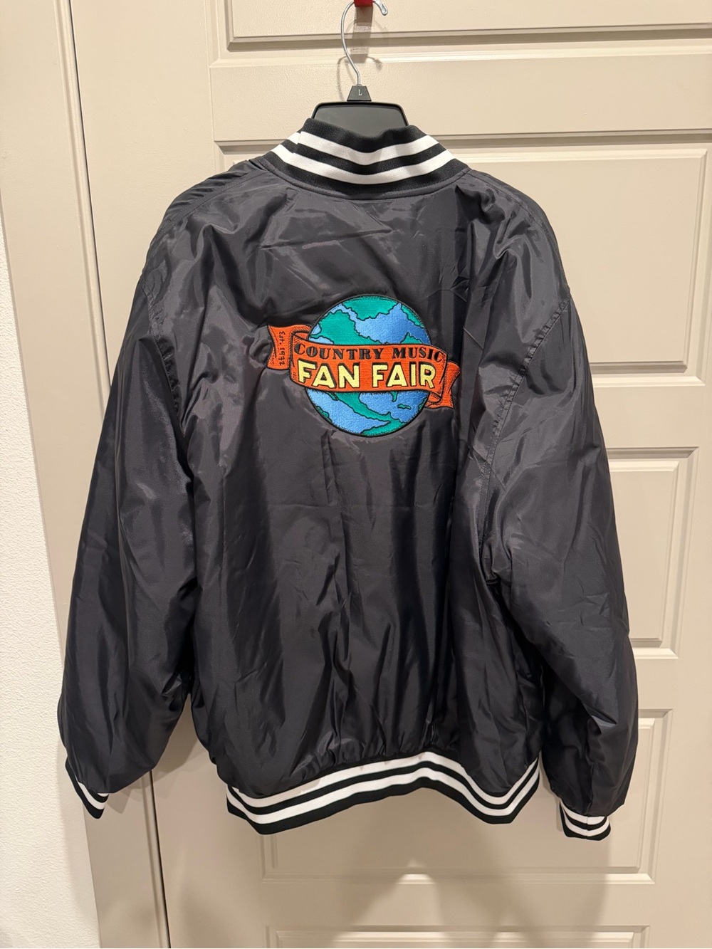 Holloway Black Bomber Jacket with Colorful 'Fan Fair' Globe Patch